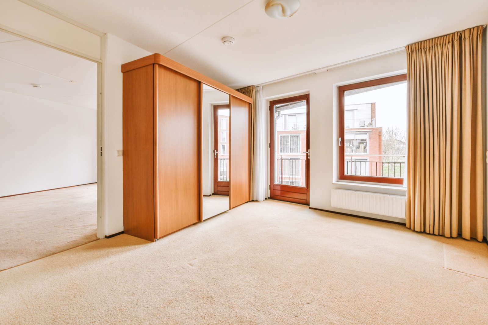 Empty bedroom with clean carpet ready for the next tenant
