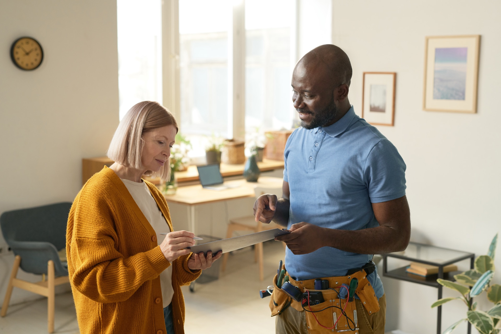 Technician walking a rental unit with a property manager to scope the make-ready
